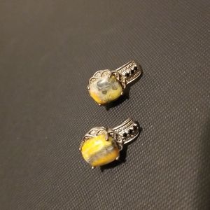 Sterling silver earrings with orange, yellow, and gray stones.